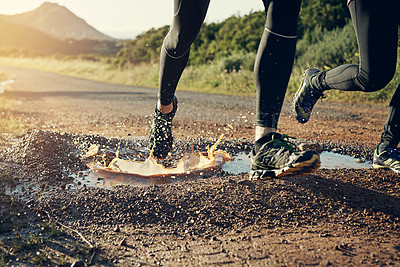 Buy stock photo Cropped shot of an unrecognizable young couple out for a morning run