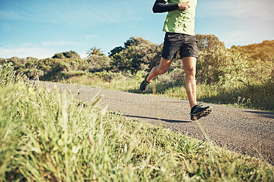 Buy stock photo Cropped shot of an unrecognizable young man out for his morning run