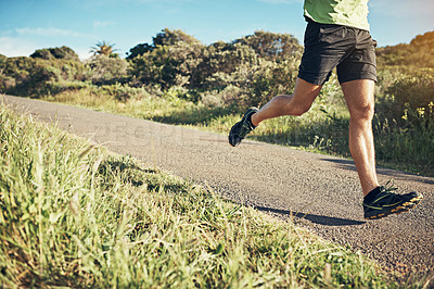 Buy stock photo Cropped shot of an unrecognizable young man out for his morning run