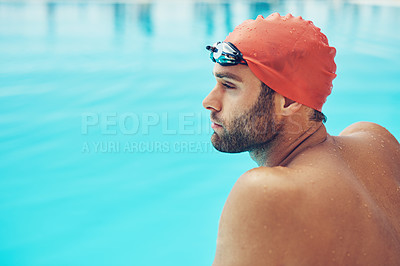 Buy stock photo Cropped shot of a handsome young male swimmer sitting on the side of a pool