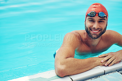 Buy stock photo High angle portrait of a handsome young male swimmer chilling in the swimming pool
