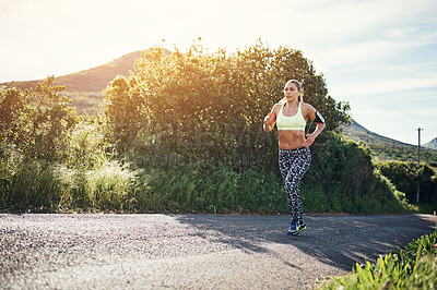 Buy stock photo Full length shot of an attractive young female athlete out for a morning run