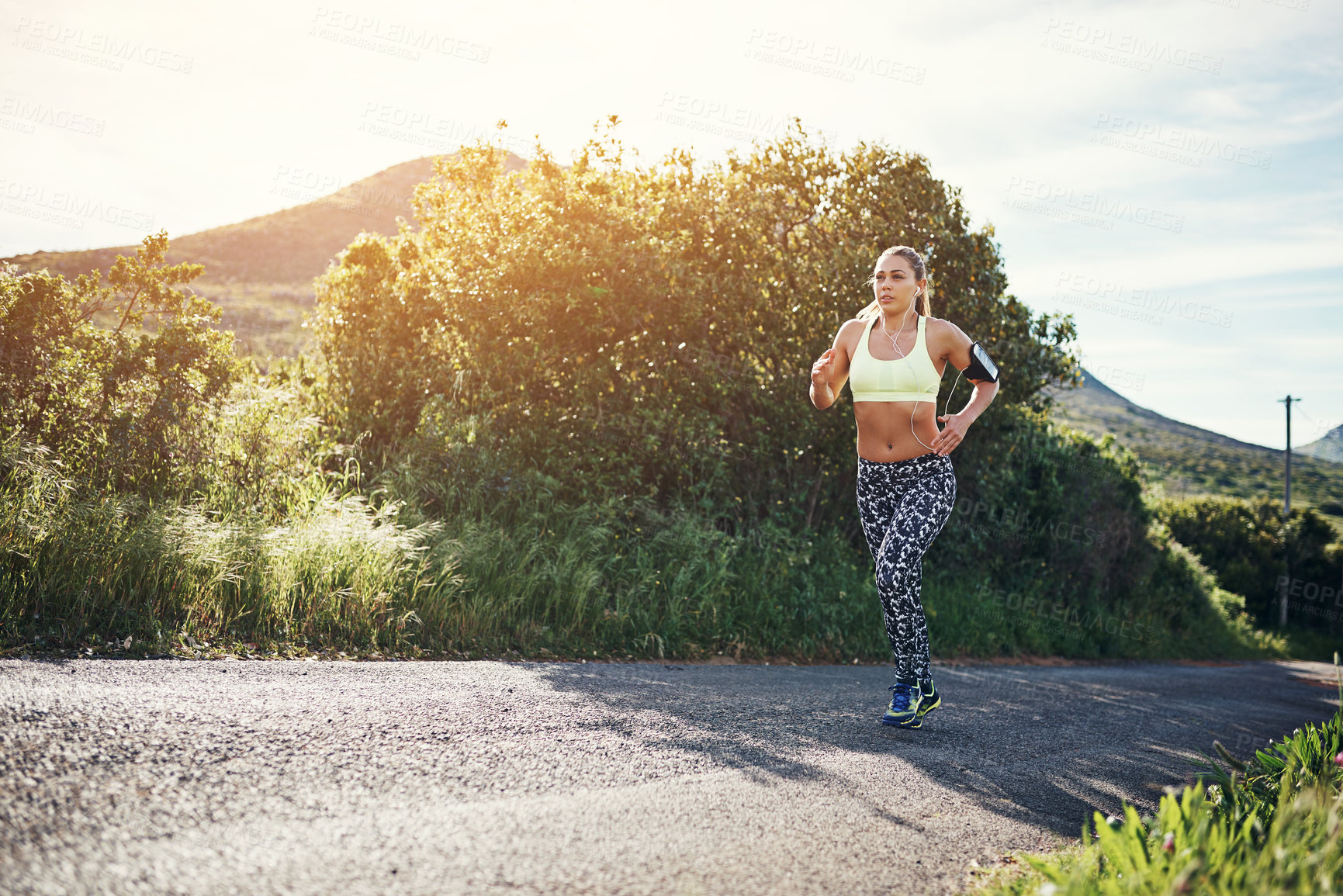 Buy stock photo Full length shot of an attractive young female athlete out for a morning run