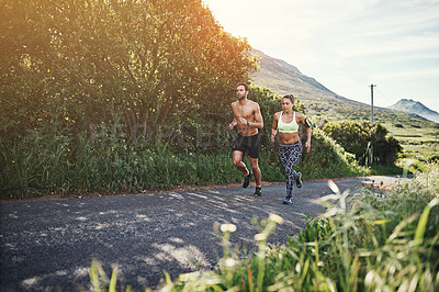 Buy stock photo Full length shot of a young couple out for their morning run