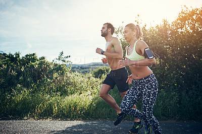 Buy stock photo Full length shot of a young couple out for their morning run