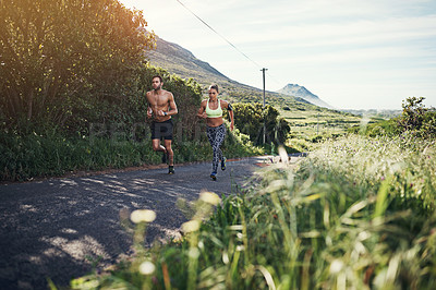 Buy stock photo Full length shot of a young couple out for their morning run