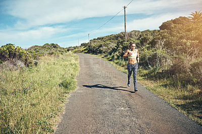 Buy stock photo Full length shot of an attractive young female athlete out for a morning run