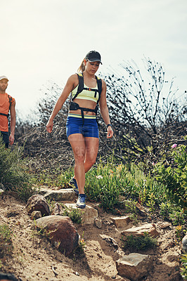 Buy stock photo Low angle shot of a young athletic couple out for their morning run