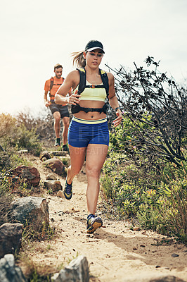 Buy stock photo Low angle shot of a young athletic couple out for their morning run