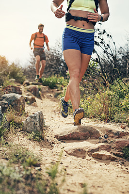 Buy stock photo Low angle shot of a young athletic couple out for their morning run