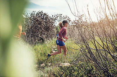 Buy stock photo Rearview shot of a young athletic couple out for their morning run