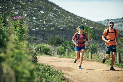 Buy stock photo Full length shot of a young athletic couple out for their morning run