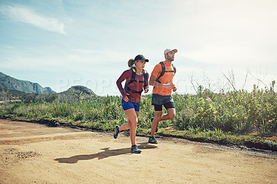 Buy stock photo Full length shot of a young athletic couple out for their morning run
