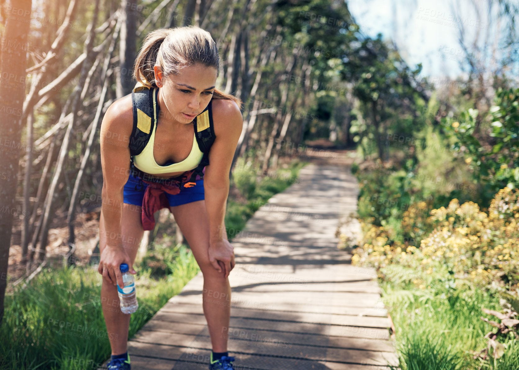 Buy stock photo Woman, breathe or tired in park with exercise for wellness, break or body fatigue with fitness in nature. Runner, athlete and rest with water for workout, running or training on trail with cardio