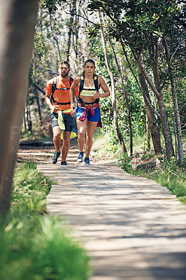 Buy stock photo Full length shot of a young athletic couple out for their morning run