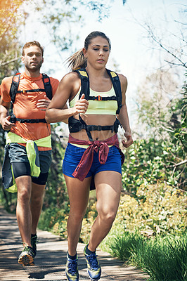 Buy stock photo Full length shot of a young athletic couple out for their morning run
