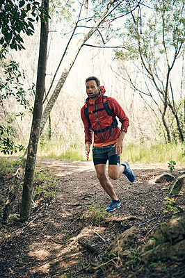 Buy stock photo Full length shot of a handsome young male athlete out for a morning run