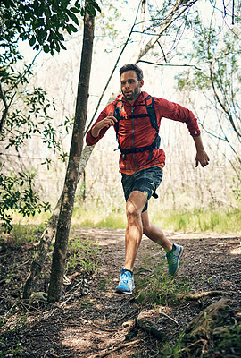 Buy stock photo Full length shot of a handsome young male athlete out for a morning run