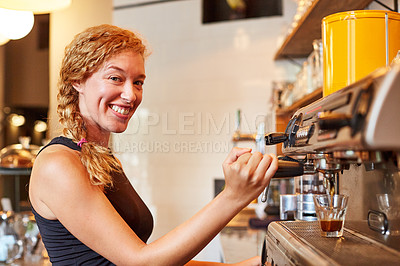 Buy stock photo Shot of a female barista on duty in a coffee shop