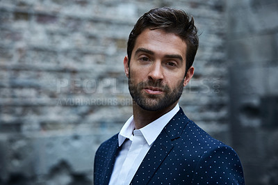 Buy stock photo Cropped portrait of a handsome young businessman standing in an urban alleyway