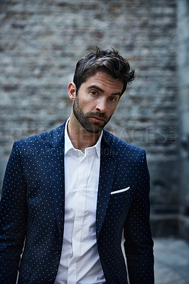 Buy stock photo Cropped portrait of a handsome young businessman standing in an urban alleyway