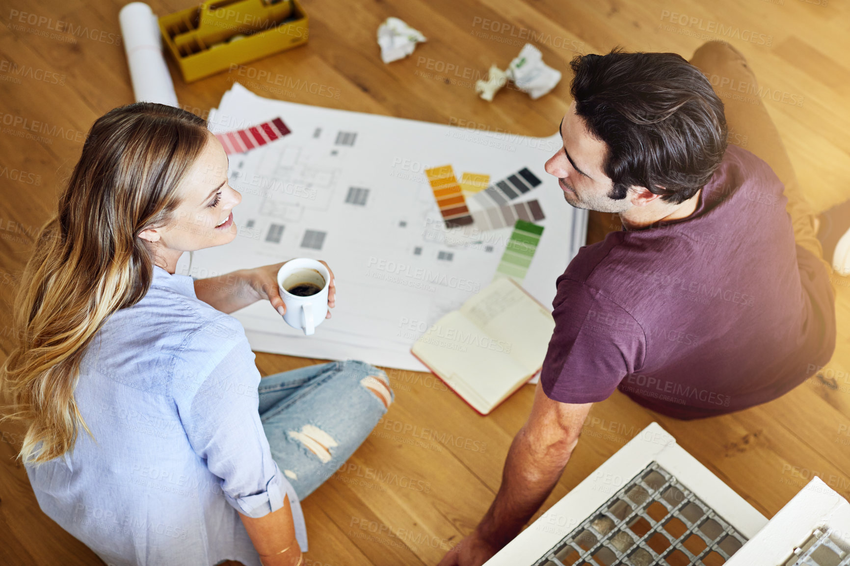 Buy stock photo Above, blueprint and couple with palette for home renovation, interior design and decision. Happy, marriage and man with woman on floor with paperwork, color choice and talking for remodeling house