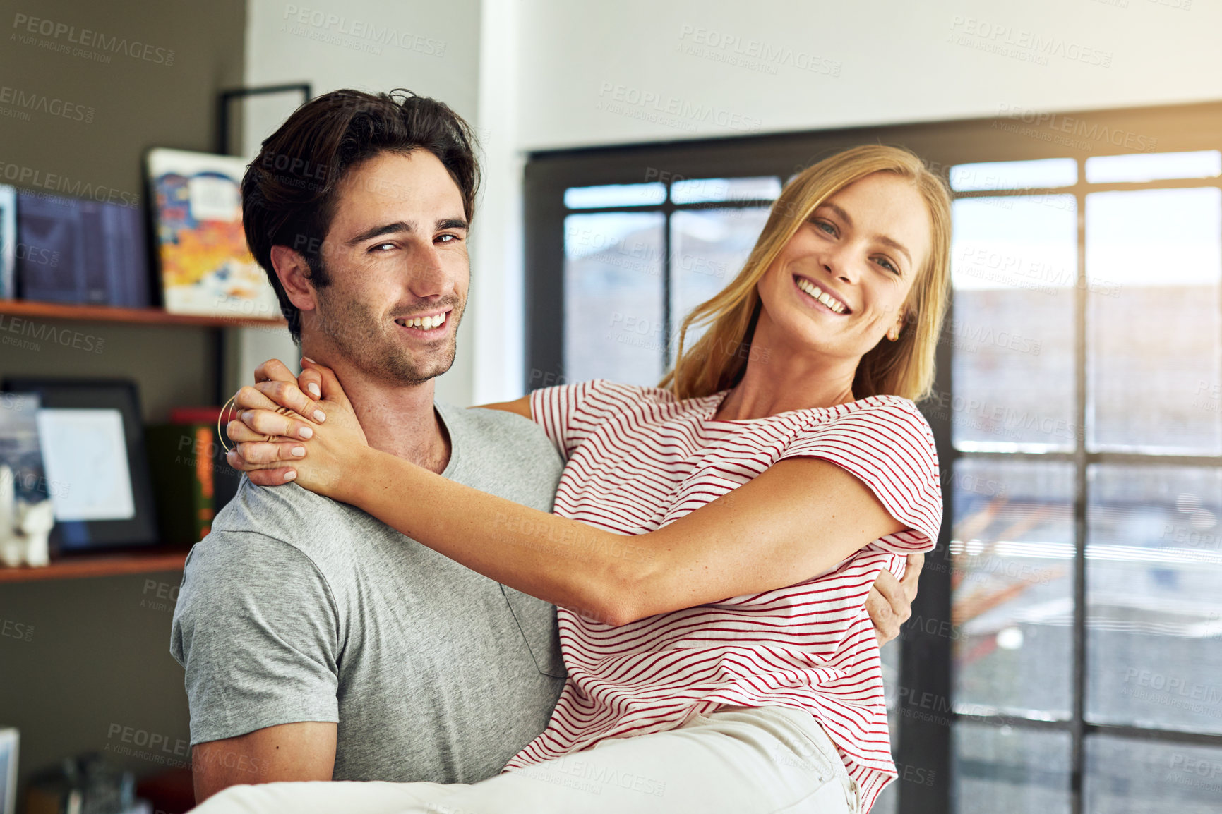 Buy stock photo Portrait, couple and carry in home for playful relationship, love and bonding on weekend break. Security, people or lifting wife in house for happy marriage, physical affection and trust with support