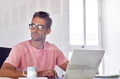 Buy stock photo Cropped shot of a young designer working on his laptop