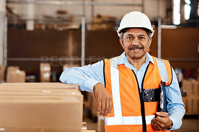 Buy stock photo Shot of a confident mature man working in a warehouse