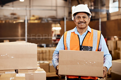Buy stock photo Shot of a confident mature man working in a warehouse