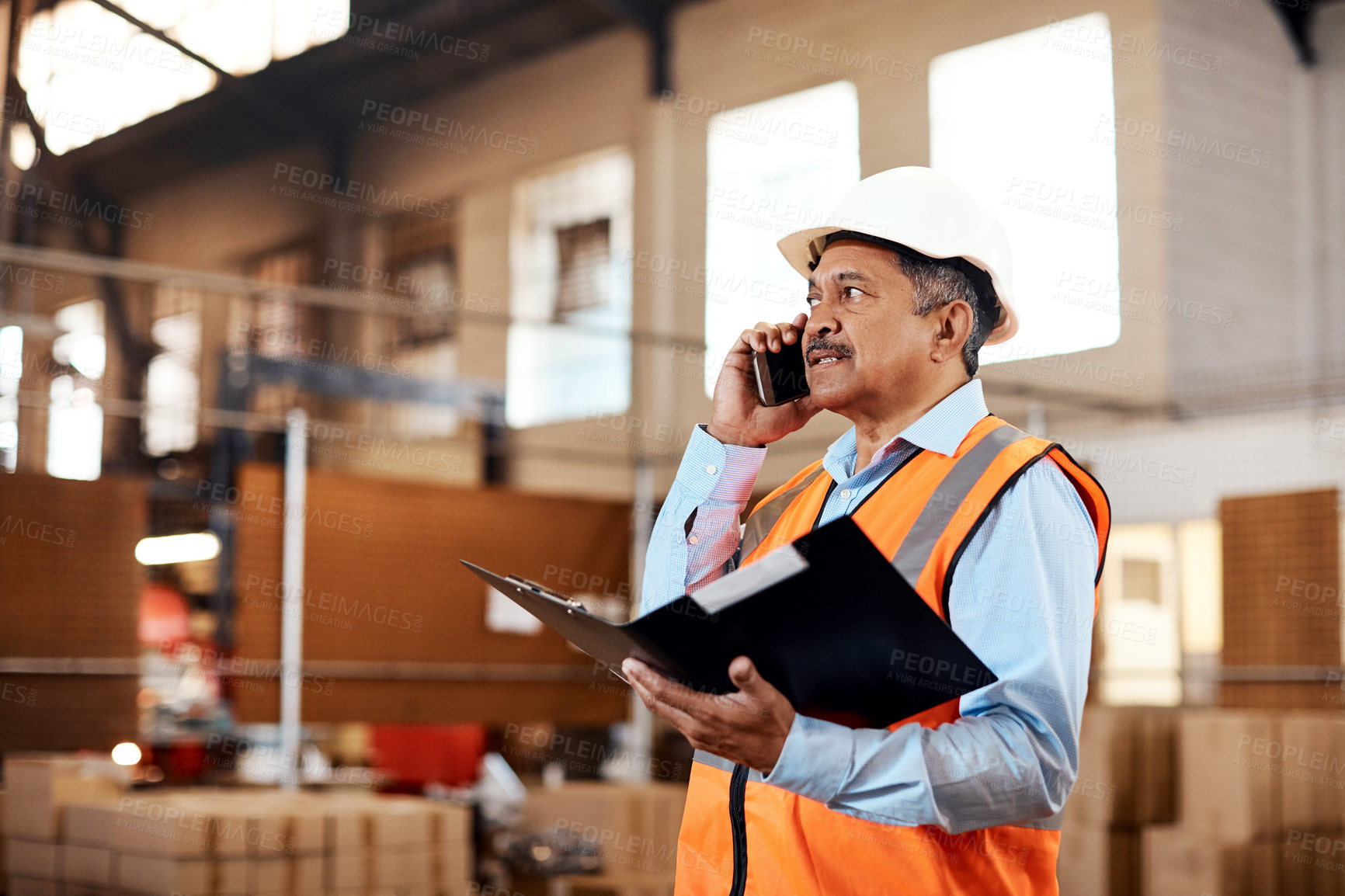 Buy stock photo Mature, man or phone call with checklist for shipping management or supply chain in warehouse. Male person, folder or talking with technology for cargo distribution, stock or inventory in storage