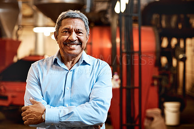Buy stock photo Shot of a confident mature man working in a factory