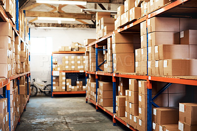Buy stock photo Shot of boxes packed on shelves in a storage room