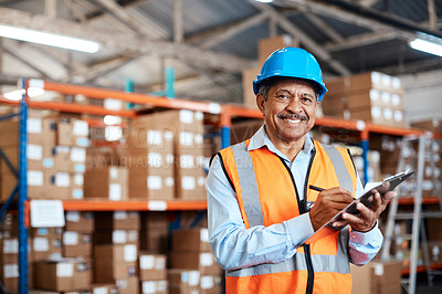 Buy stock photo Shot of a mature man doing inventory in a warehouse