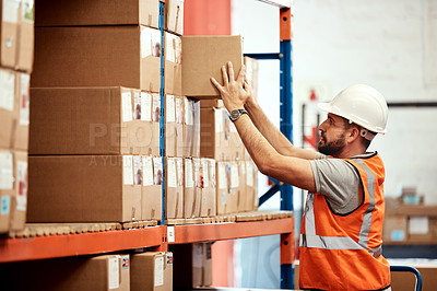Buy stock photo Shot of a young man working in a warehouse