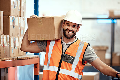 Buy stock photo Portrait of a young man holding a box while working in a warehouse