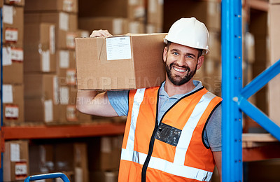 Buy stock photo Portrait of a young man holding a box while working in a warehouse