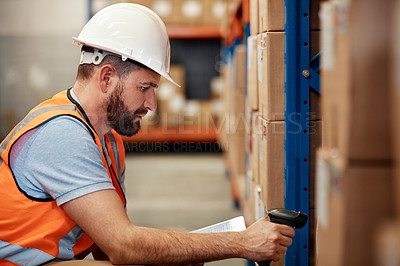 Buy stock photo Shot of a young man using a barcode reader and digital tablet in a warehouse
