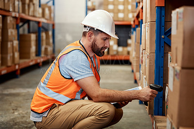 Buy stock photo Shot of a young man using a barcode reader and digital tablet in a warehouse