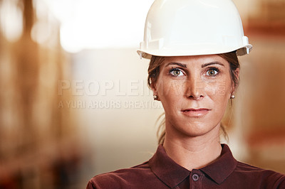 Buy stock photo Portrait of a young woman standing in a warehouse