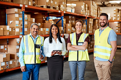 Buy stock photo Portrait of a group of factory workers standing together in a warehouse