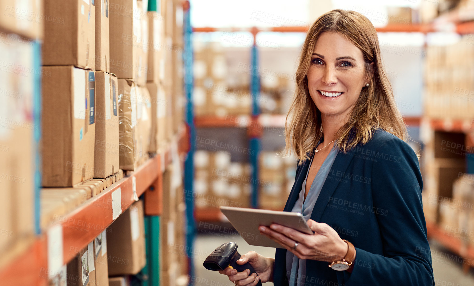 Buy stock photo Portrait of a young factory manager using a barcode reader and digital tablet in a warehouse