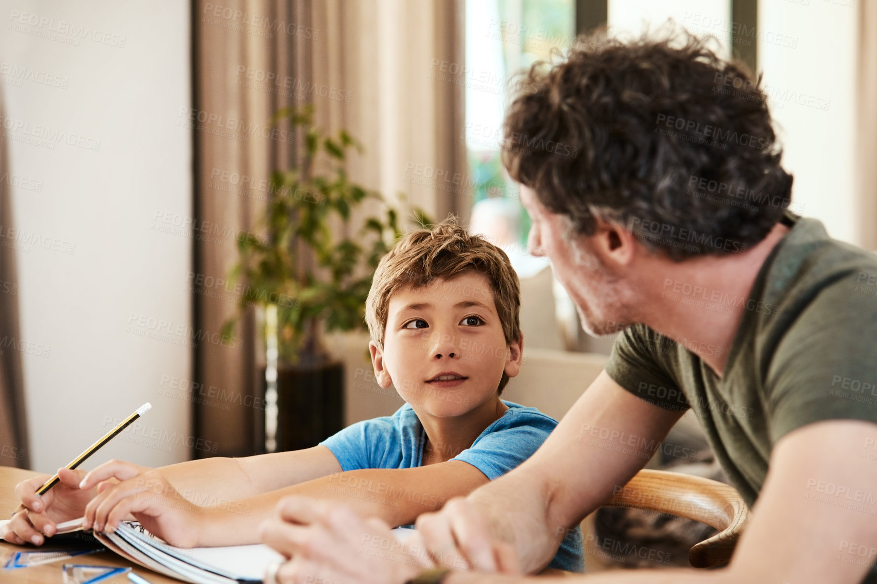 Buy stock photo Homework, talking and dad with son for help, assignment and teaching skills for development. Family, home and father with child for writing, assessment and learning for education, love and parenting