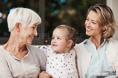 Buy stock photo Shot of a happy senior woman spending quality time with her daughter and granddaughter at home