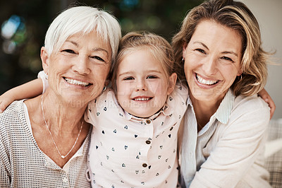 Buy stock photo Shot of a happy senior woman spending quality time with her daughter and granddaughter at home