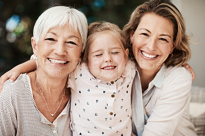 Buy stock photo Shot of a happy senior woman spending quality time with her daughter and granddaughter at home