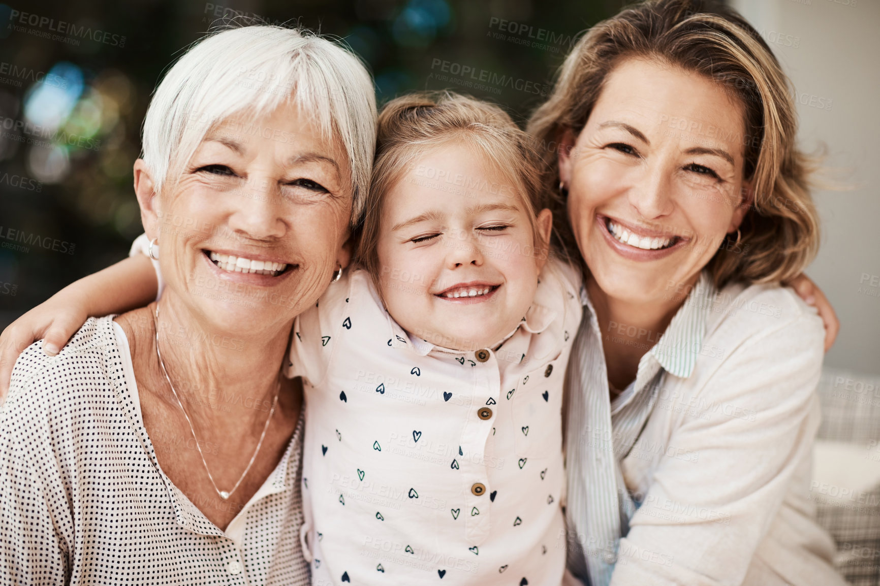 Buy stock photo Shot of a happy senior woman spending quality time with her daughter and granddaughter at home