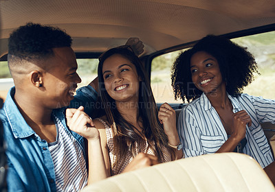 Buy stock photo Shot of a group of happy young friends dancing during a road trip