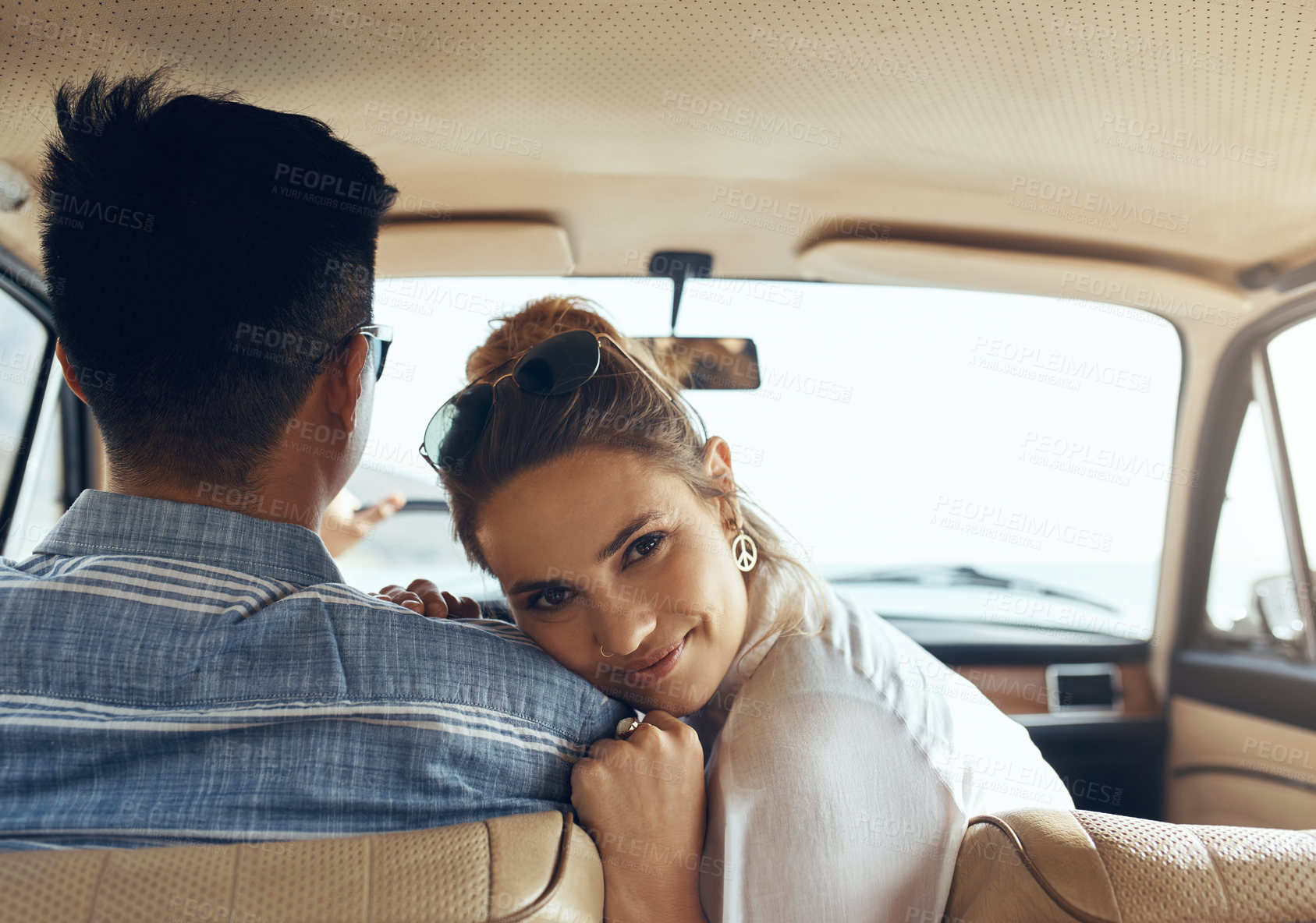 Buy stock photo Portrait of a happy young couple going on a road trip together