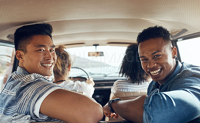Buy stock photo Shot of a group of happy young friends going on a road trip together